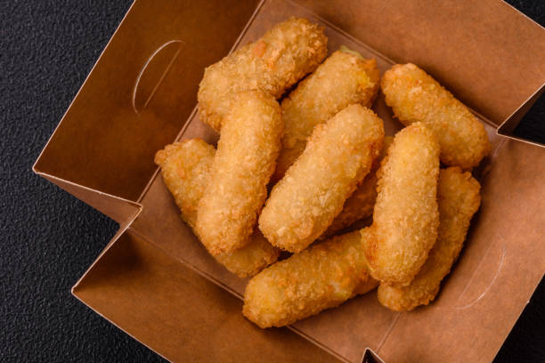 istock Fast food breaded cheese sticks with salt and spices 2172071168