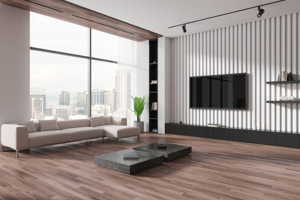 istock Stylish home living room interior with couch and tv screen, panoramic window 2172071596