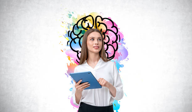 istock Woman holding tablet with colorful brain illustration in backgro 2172072087
