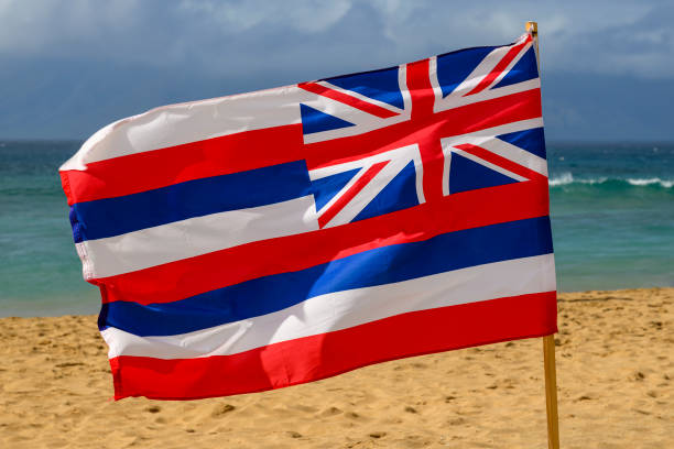 The Hawaiian flag in the wind at a beach in Hawaii