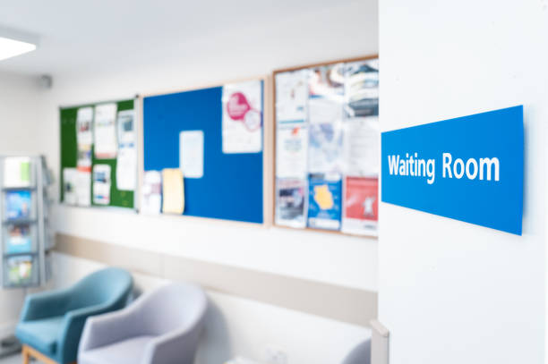 Shallow focus of a typical NHS hospital waiting room sign seen in a British hospital. stock photo
