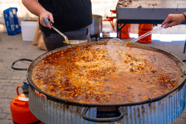 istock A man is cooking food in a large pot 2172077789