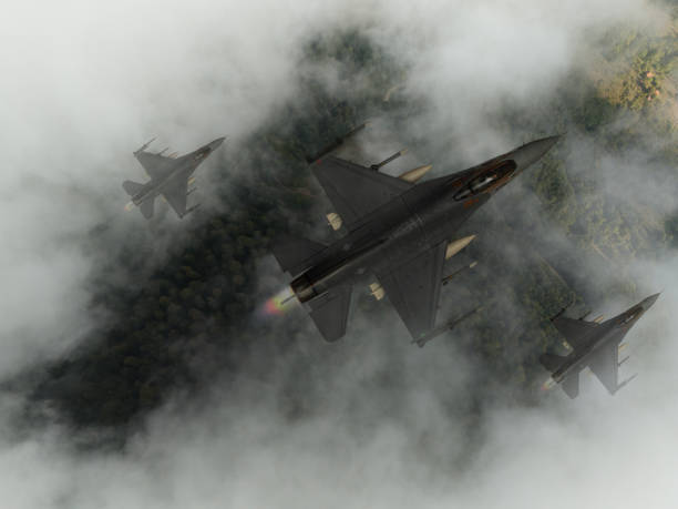 istock Jet fighters flying over forest in a cloudy day. 2172078390