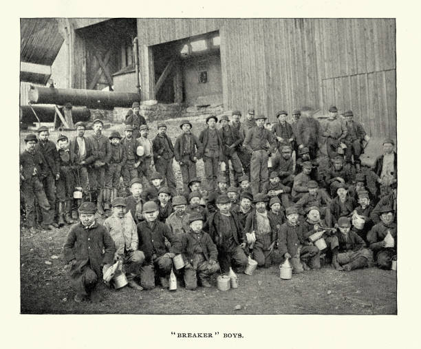 History of mining, Breaker boys at a coal mine, Pennsylvania, USA , Victorian, 1890s, Vintage photograph 19th Century. A breaker boy was a coal-mining worker in the United States and United Kingdom whose job was to separate impurities from coal by hand in a coal breaker.