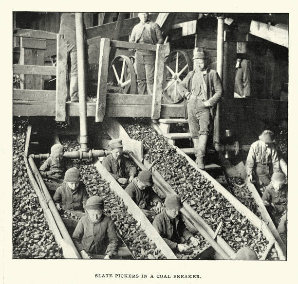 History of mining, Child labour, Slate pickers in a coal breaker, Breaker boys, Pennsylvania, USA , Victorian, 1890s, Vintage photograph 19th Century History of mining, Slate pickers in a coal breaker, Breaker boys, Pennsylvania, USA , Victorian, 1890s, Vintage photograph 19th Century. A breaker boy was a coal-mining worker in the United States and United Kingdom whose job was to separate impurities from coal by hand in a coal breaker. sorter machine stock illustrations