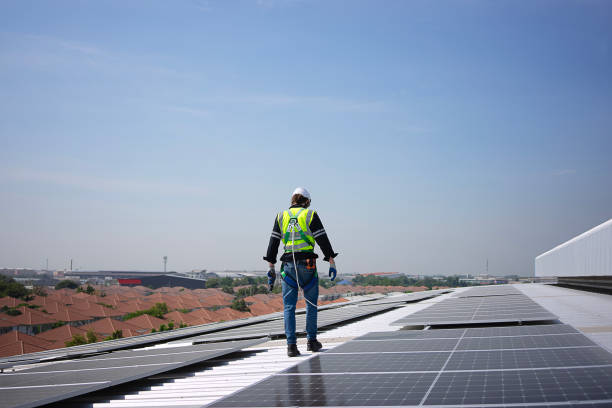 istock Blue collar worker is inspecting solar panel at rooftop of factory. 2172080087