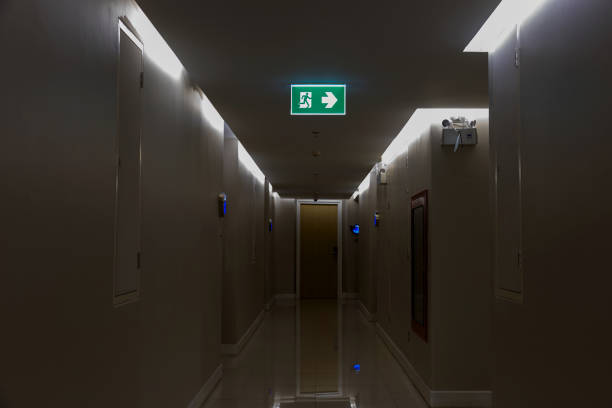 istock Green emergency exit sign showing the way to escape. 2172090411