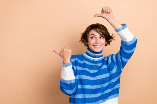 istock Photo of dreamy cute lady wear blue pullover looking pointing two thumbs empty space isolated beige color background 2172093817