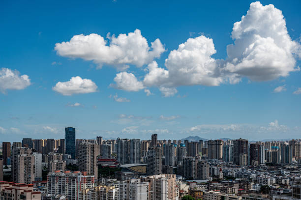 istock The city under the blue sky and white clouds 2172096659