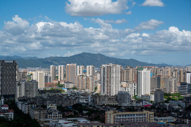 istock City architecture under clear blue sky and white clouds 2172096697