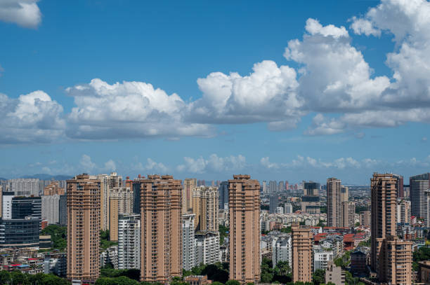 istock City architecture under clear blue sky and white clouds 2172096724