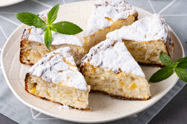 Appetizing cottage cheese casserole on white plate close up