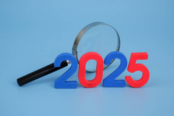 istock Magnifying glass and numbers 2025. 2172097265