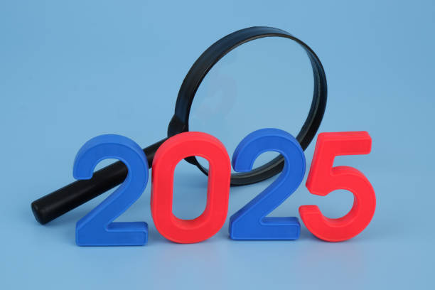 istock Magnifying glass and numbers 2025. 2172097315