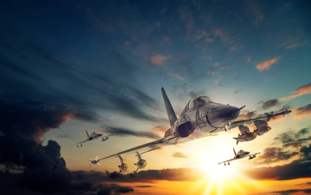 istock Jet airplanes flying over the clouds at sunset. 2172097785
