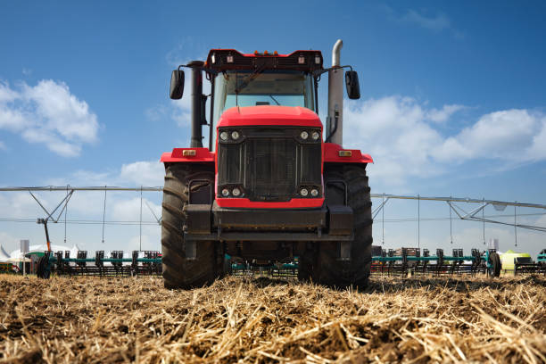 istock A large tractor work with a plow in a field. Start tillage after harvest. 2172100039