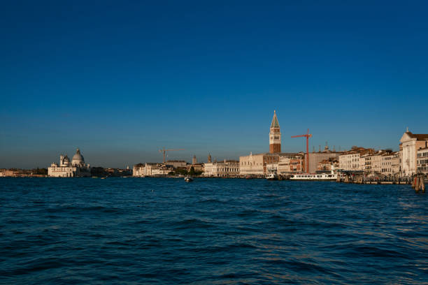 St Mark's Square bell tower at sunset with the Grand Canal