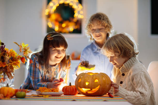 istock Family carving pumpkin for Halloween 2172100748