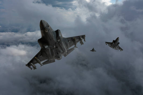 istock Jet aircrafts flying over the clouds. 2172101023