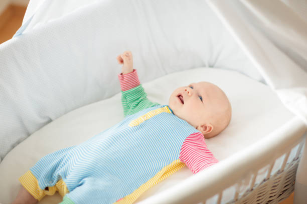 istock Little baby on white bed 2172101285