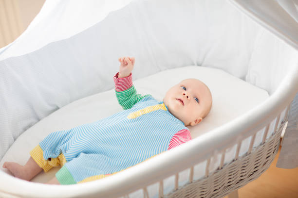 istock Little baby on white bed 2172101304