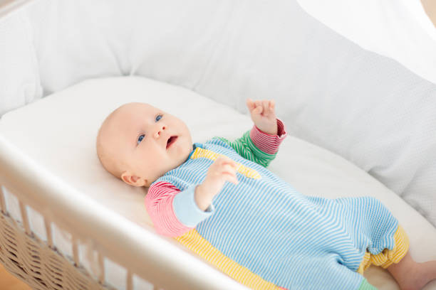 istock Cute baby boy in a white crib 2172101673