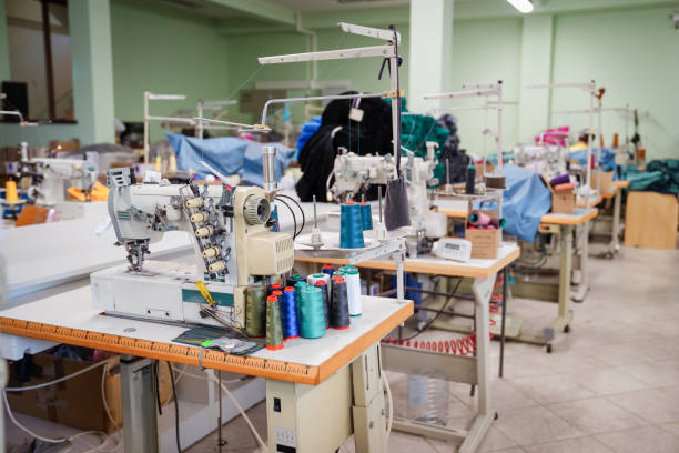 Textile factory without people, workplace with sewing machines