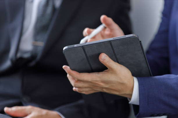 istock Close up digital tablet. Businessman typing reading information on tablet meeting planning discussing online project in office. 2172102426