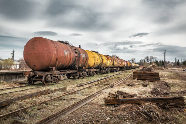 Old rusty railway oil tankers on abandoned railway. Industrial transportation theme