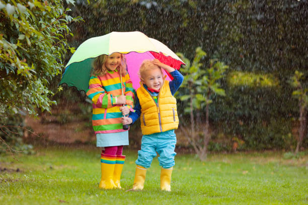 istock Kids playing in autumn park 2172104529
