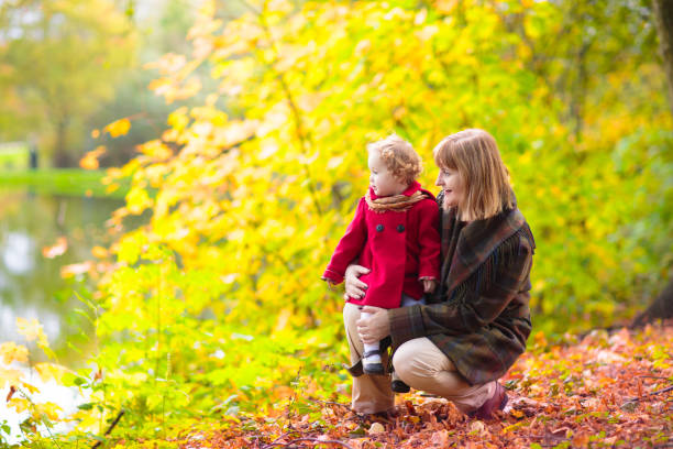 istock Kids playing in autumn park 2172105159