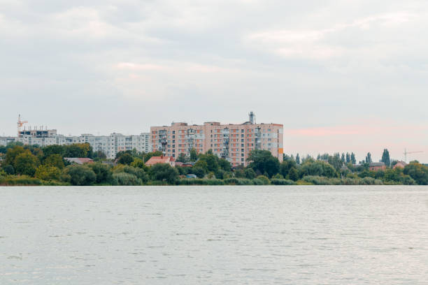 istock overcast third world developed country USSR panel architecture living panel apartment building on river waterfront abandoned wasteland country side outskirts settlement town scape rainy cloudy view 2172108763