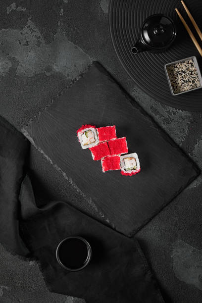 istock Gourmet Shrimp and Masago Roll on Slate with Dark Aesthetic Lighting 2172116855