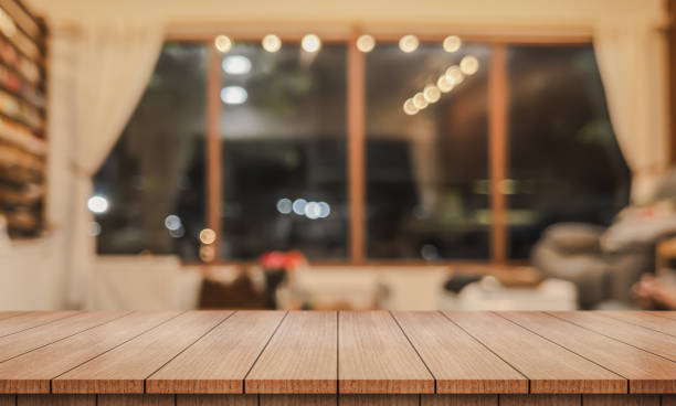 istock Empty wooden table top with lights bokeh on blur restaurant background. 2172120962