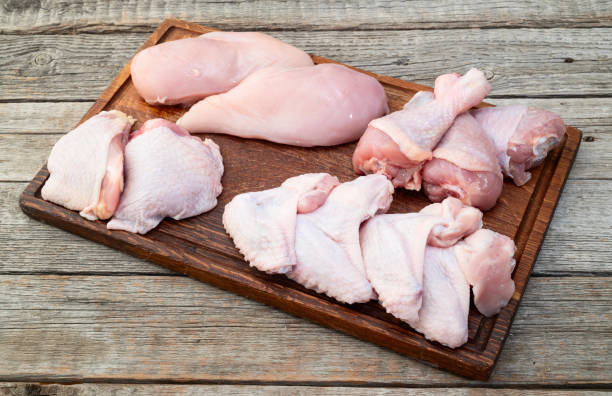 istock Raw mixed chicken meat parts  for cooking on rustic background 2172122485