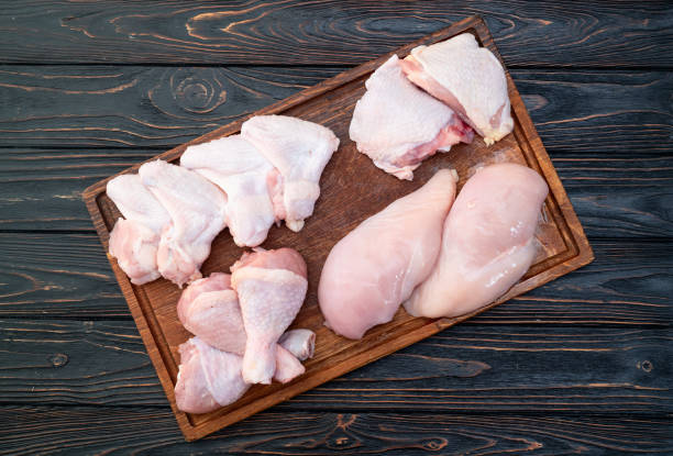 istock Raw mixed chicken meat parts  for cooking on rustic background 2172122536