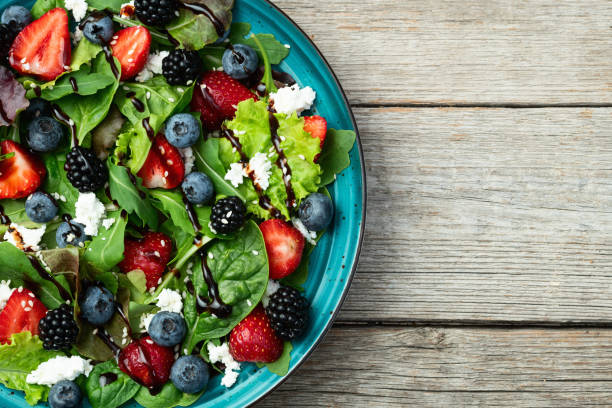 istock Berries salad (blueberry strawberry blackberry ) with cheese feta and balsamic sauce 2172122596