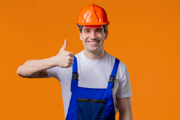 istock Positive builder in helmet, protective uniform makes hand sign like, thumbs up 2172124207