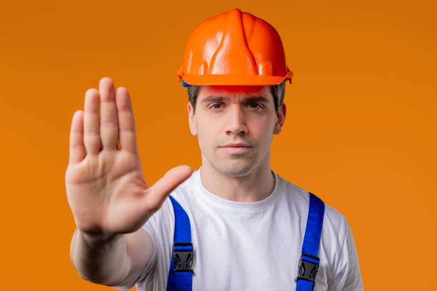 istock Serious handyman showing Rejecting Gesture By Stop Palm. Not Allow, Prohibition 2172124237