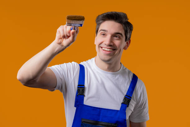 istock Creative handyman painter artist with brush on orange background. Fantasy, idea 2172124245