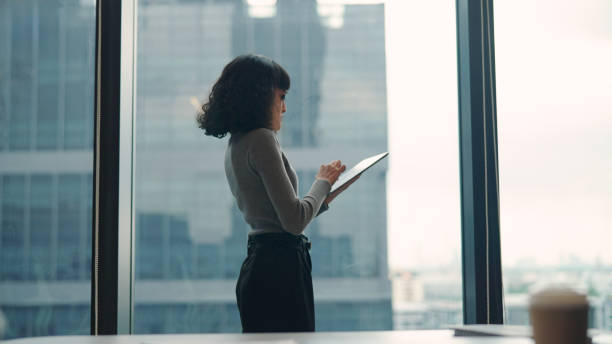 istock Asian woman using tablet to working 2172126725