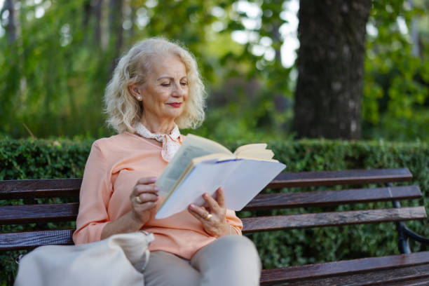 istock Senior Woman Relaxing With a Good Book 2172129005