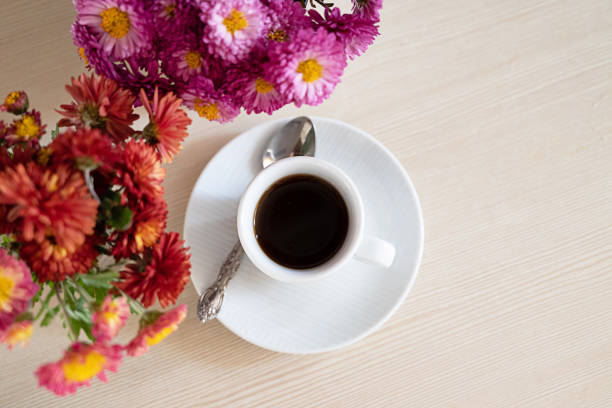 istock Autumn composition. Cup of coffee, notepad, fresh flowers on white background. Autumn, fall concept. Flat lay, top view, copy space 2172131479