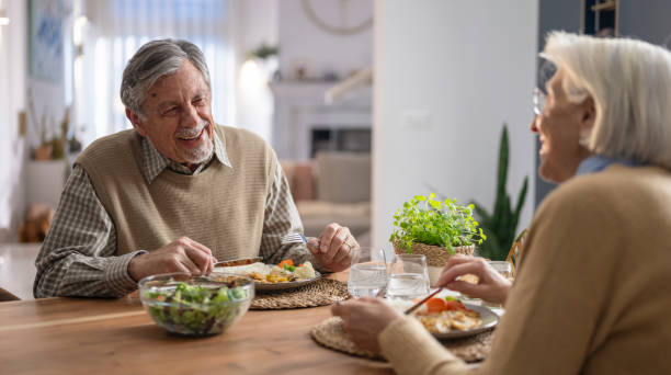 istock Elderly Couple Enjoying a Meal Together 2172137774