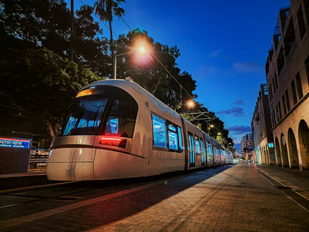 istock Modern tram at night on city street 2172139104
