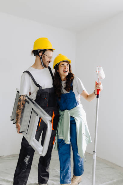 istock Young workers with painting tools indoors. Room renovation 2172142511