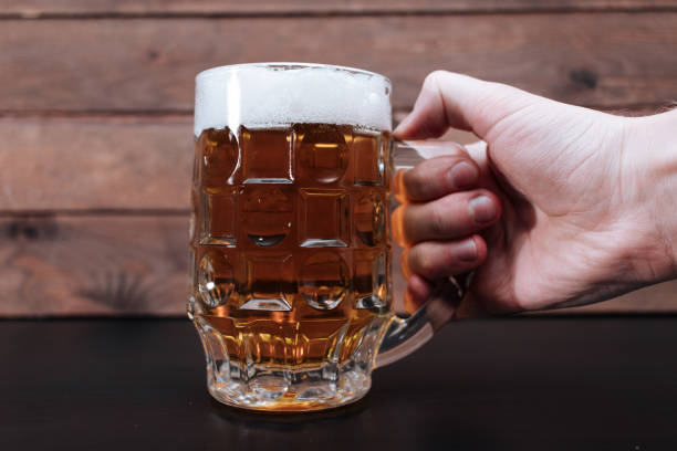 istock Hand holding glass of beer 2172143556