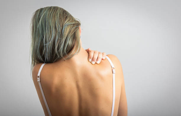 istock Woman suffering from nape pain using hand to massage 2172145839