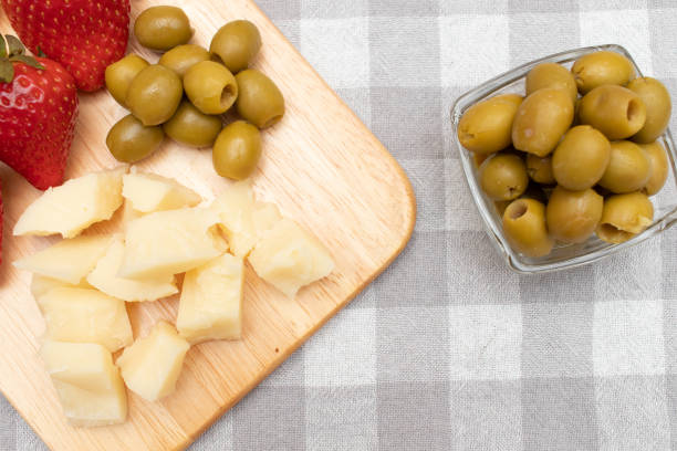 Delicious appetizer-tapa composed of olives and cheese with hard bread sticks. It is typical in Spain that when you order a drink in a bar they serve you and you can consume for free a tapa that is randomly chosen by the restaurant service.