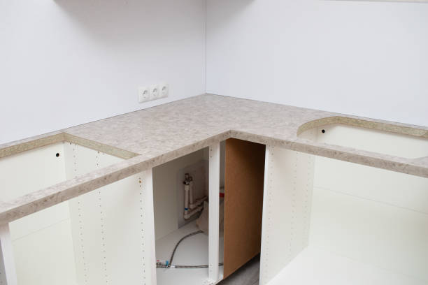 istock Kitchen installation. Assembling furniture in the kitchen 2172148962